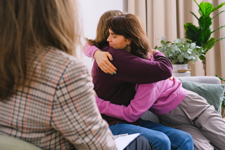 Couple hugging during Perth couples counselling session